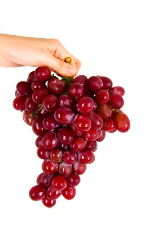 red grapes isolated on whiteの写真素材
