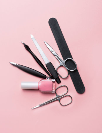 Accessories for manicure or pedicure fashion concept of nail hand and foot care copy space for text or inscription pink nail lacquer top viewの写真素材
