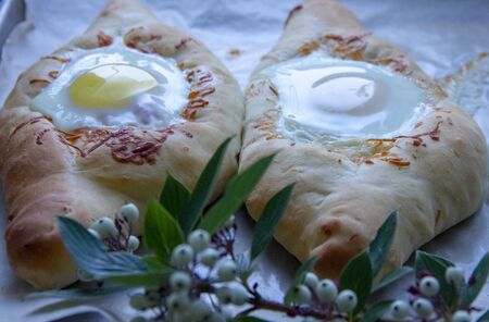 homemade baking on parchment. Khachapuri from the oven. Georgian dish.の写真素材