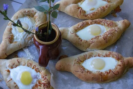 homemade baking on parchment. Khachapuri from the oven.