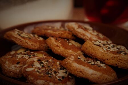 homemade honey cookies with seeds on a plate. tea time. Sweet treat for the holiday.の写真素材