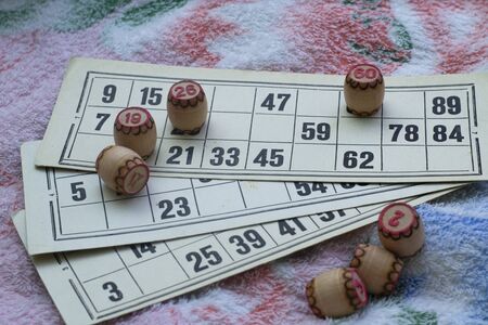 The child plays lotto. hold the barrels in your hands. board game during the weekend and insulation...