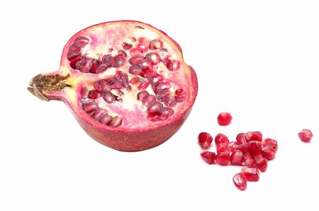Cutted pomegranate with seedsの写真素材