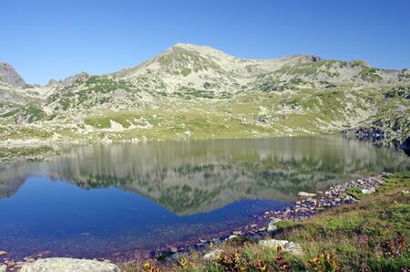 Mirroring mountain, reflexion in Bucura lake, Retezat National Park