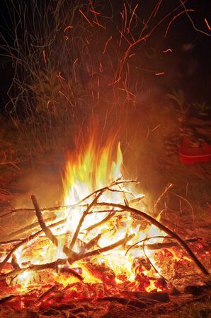 Camp fire in the night on the mountain