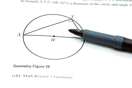 Draw a geometry figure on white paper の写真素材
