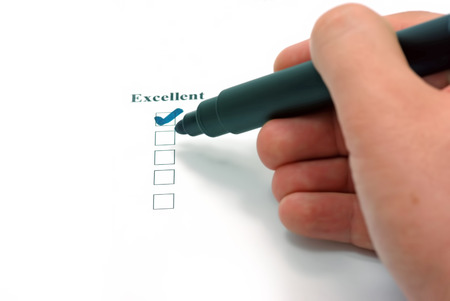 Hand with a marker, excellent customer service の写真素材