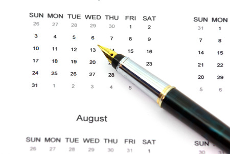 Close up image of a pen on a calendar.の写真素材