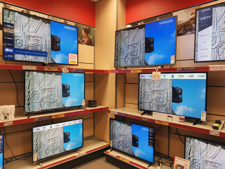BACAU, ROMANIA - AUGUST 5, 2018: Samsung TV screens for sale on racks in Altex Megastoreのeditorial素材
