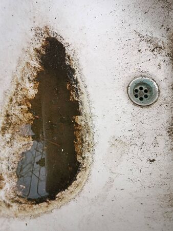 Grunge and dirty ceramic wash basin, close image