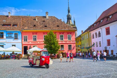 SIGHISOARA, ROMANIA - AUGUST 19, 2019: Pietonal road in medieval citadel of Sighisoara, many tourists visitingのeditorial素材