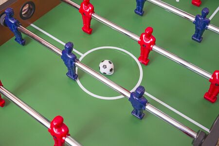 Soccer table game play in family