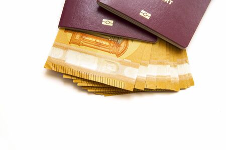 Family biometric passports and euro banknotes, close imageの写真素材