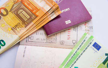 Close image of euro currency and passport visa stampsの写真素材
