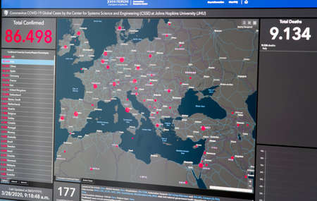 PIATRA NEAMT, ROMANIA - MARCH 28, 2020: Total confirmed and deaths of Coronavirus (Covid19) in Italy, Europe interactive map on Johns Hopkins Resource Center page,のeditorial素材