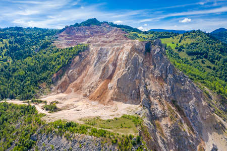 Aerial scene of cement rock quarry, rock layers in Romanian Carpathians mountain