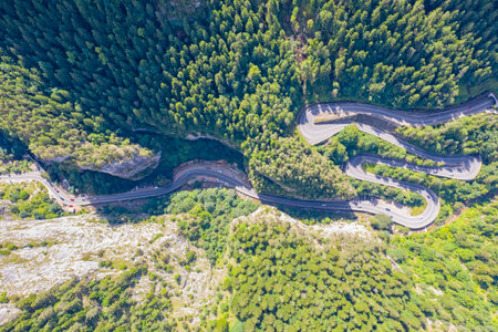 Above view of mountain curvy road in Romanian Carpathians, Bicaz Gorges is a narrow pass road...