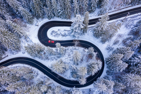 Curvy mountain road viewed from above. Bicaz Gorges is a narrow pass in Romanian Carpathians between Moldavia and Transylvaniaの写真素材