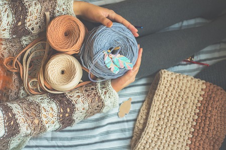 Woman holds reel threadの写真素材