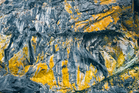 Macro texture cliffs. Yellow mountain worn rock backgroundの写真素材