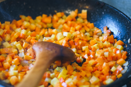 Chopped carrots frying on the pan. Healthy eating and lifestyle. Food background.の写真素材