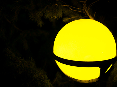Street vintage lamp with christmas tree in the evening outsideの写真素材