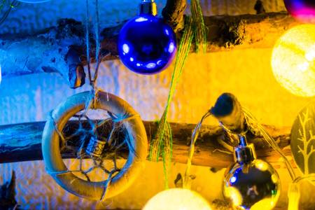 Decorated Christmas tree on blurred, sparkling and fairy background.