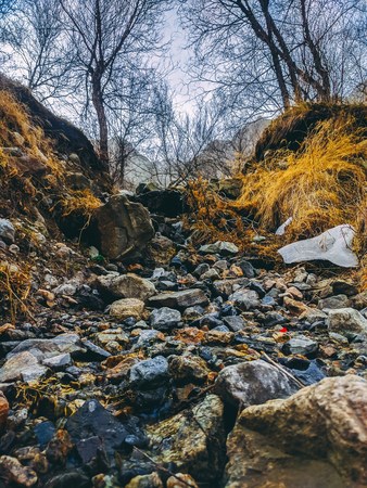 Mountain peak range landscape. Mountain meadow with mossy piled stones in springtime as natural background.の写真素材