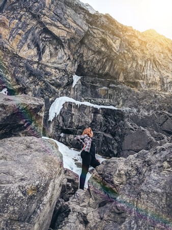Freedom traveler woman. A female tourist, admiring the mountains, walking in the mountains.の写真素材