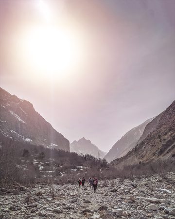 Hikers in the mountains. Group people backpackers tourists climbing struggling ascending rock mountain ridge travel tourism destination hiking.の写真素材