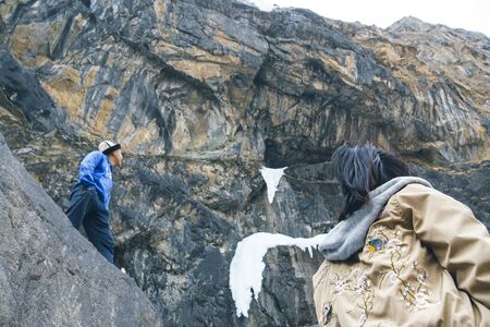 Belogorka, Kyrgyzstan - March 25, 2018: Hikers in the mountains. Hiking team in the mountains. travel sport lifestyle concept.のeditorial素材