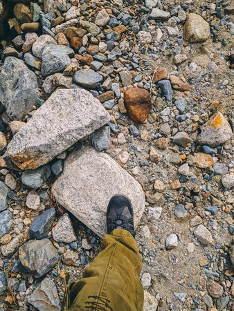Feet trekking boots hiking Traveler alone outdoor wild nature Lifestyle Travel extreme survival conceptの写真素材