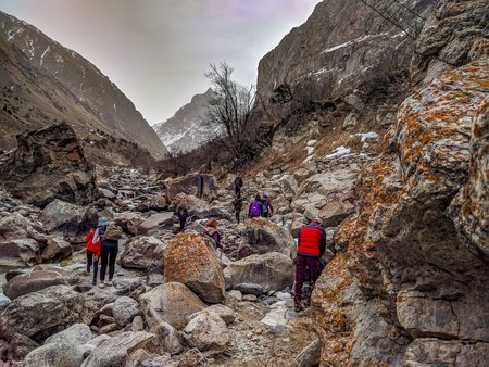 Hikers in the mountains. Group of friends or tourists walks at mountains viewpoint. Travel or tourism concept.の写真素材