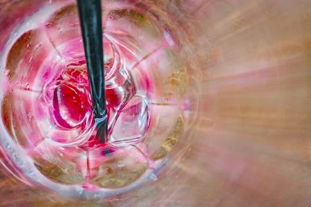 Ice cubes in a empty glass with one black tubes. Hot Sunny day. Copy spaceの写真素材