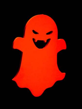 Halloween red ghost flying in sky isolated on black background. Scary night. Halloween october. Isolatedの写真素材