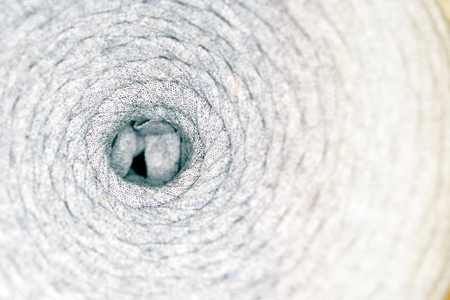 Center of coil thread. Top view. Reel or spool of cotton thread being pulled out.の写真素材
