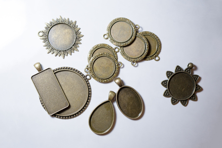 Metal billets for making ornaments. Vintage metal medallion frames.の写真素材