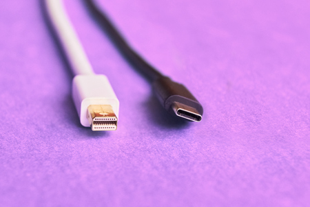 Closeup of mini display and usb type C cables on purple backgroundの写真素材
