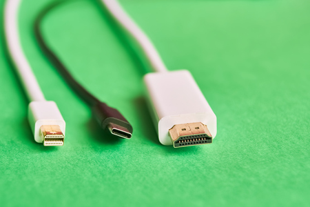 Closeup of HDMI , mini display port and type C cables on green backgroundの写真素材