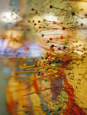 Colorful detail map macro close up with push pins marking locations throughout.の写真素材