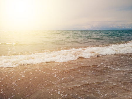 Small wave on a sunny day by the sea. Beach. The coast of the Baltic Sea with small waves on a sunny day.の写真素材