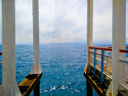 Rusty metal pier support. Attractive view under the pier. Perspective of metal rusty bridge structureの写真素材