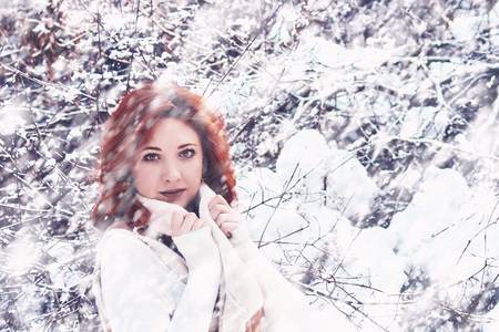 Well dressed woman enjoying the winter. Concept of warm winter clothesの写真素材