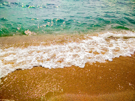 Small wave on a sunny day by the sea. Beach. The coast of the Baltic Sea with small waves on a sunny...