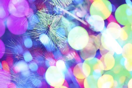 Christmas or New Year fir tree with decorative lights. Close up of Christmas tree. Blur shot of the...