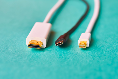 Closeup of HDMI , mini display port and type C cables on blue backgroundの写真素材