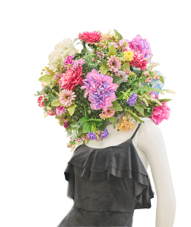 Mannequin with a bouquet of flowers instead of a head on a white isolated backgroundの写真素材