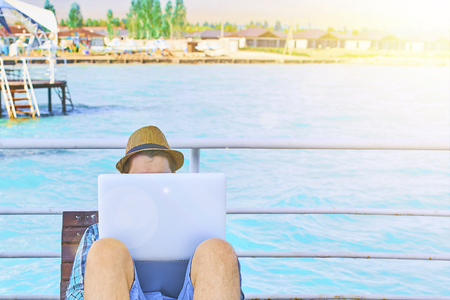 Businessman Holiday Working Business Travel Beach Concept.の写真素材