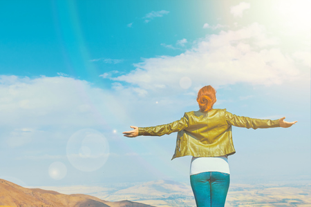 Freedom concept. Beauty woman outdoors enjoying nature. Free Woman Enjoying Nature. Happiness Female Outdoors.の写真素材