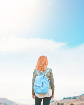 Awesome woman outdoors enjoying nature on mountains. Adventure conceptの写真素材